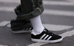 Dani Verdari seen wearing black Adidas gazelle sneaker, white socks, blau / green wide jeans trousers before the William Fan show during the Berlin Fashion Week AW23 on January 16, 2023 in Berlin, Germany.