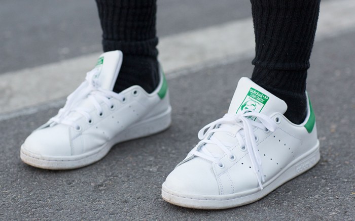 woman wearing adidas stan smith shoes