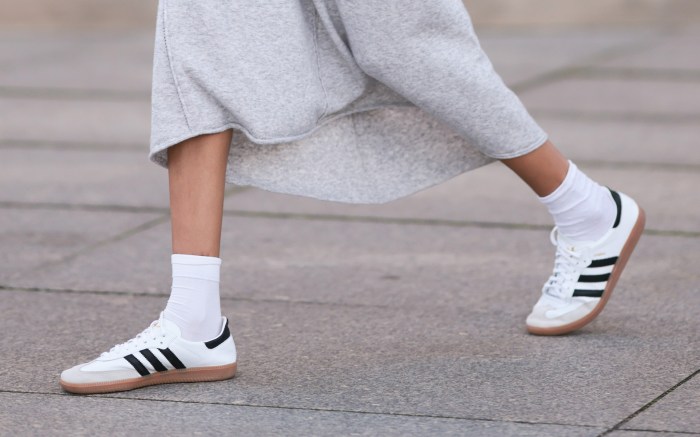 Woman wearing a white pair of the best adidas sambas in a dress