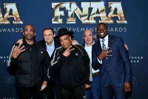 NEW YORK, NEW YORK - DECEMBER 04: (L-R) Darryl McDaniels, Bjorn Gulden, Joseph Reverend Run Simmons and Grant Holloway  attend Footwear News Achievement Awards (FNAAs) 2024 at Cipriani South Street on December 04, 2024 in New York City.  (Photo by Roy Rochlin/Footwear News via Getty Images)