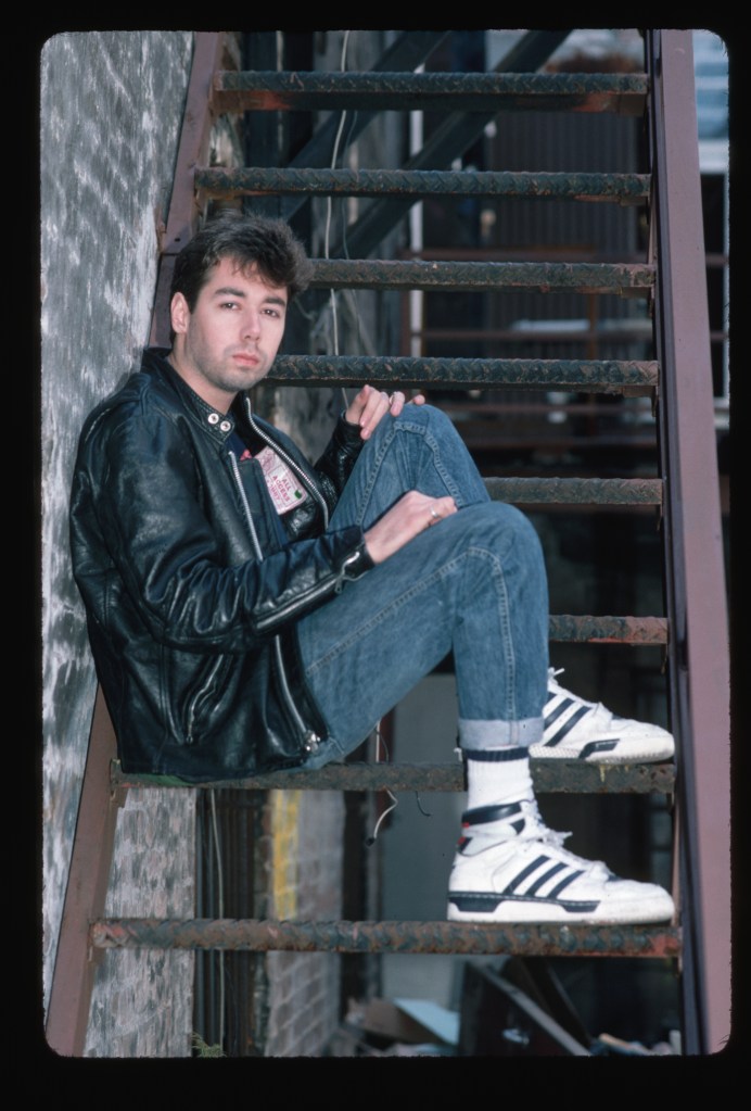 MCA, Adam Yauch, of the Beastie Boys poses on a fire escape.   (Photo by Lynn Goldsmith/Corbis/VCG via Getty Images)