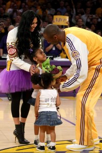 LOS ANGELES, CA - MAY 07:  Kobe Bryant #24 of the Los Angeles Lakers is greeted by his wife, Vanessa, and daughters Natalia and Gianna, after receiving the MVP trophy before the start of Game Two of the Western Conference Semifinals against the Utah Jazz during the 2008 NBA Playoffs on May 7, 2008 at Staples Center in Los Angeles, California.  NOTE TO USER: User expressly acknowledges and agrees that, by downloading and/or using this Photograph, user is consenting to the terms and conditions of the Getty Images License Agreement.  (Photo by Stephen Dunn/Getty Images)*** Local Caption *** Kobe Bryant;Vanessa Bryant;Natalia Bryant;Gianna Bryant