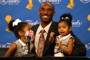 LOS ANGELES, CA - JUNE 15:  Kobe Bryant #24 of the Los Angeles Lakers sits with daughters Natalia, left, and Gianna, right, in a press conference after the Lakers' win over the Boston Celtics in Game Five of the 2008 NBA Finals on June 15, 2008 at Staples Center in Los Angeles, California.  NOTE TO USER: User expressly acknowledges and agrees that, by downloading and/or using this Photograph, user is consenting to the terms and conditions of the Getty Images License Agreement.  (Photo by Jed Jacobsohn/Getty Images)