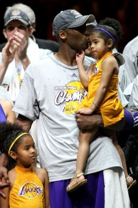 ORLANDO, FL - JUNE 14:  Kobe Bryant #24 of the Los Angeles Lakers kisses his daughter, Gianna, as daughter Natalia stands by his side after the Lakers defeated the Orlando Magic 99-86  in Game Five of the 2009 NBA Finals on June 14, 2009 at Amway Arena in Orlando, Florida.  NOTE TO USER:  User expressly acknowledges and agrees that, by downloading and or using this photograph, User is consenting to the terms and conditions of the Getty Images License Agreement.  (Photo by Elsa/Getty Images)