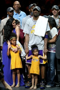 ORLANDO, FL - JUNE 14:  Kobe Bryant #24 of the Los Angeles Lakers smiles with his wife Vanessa and his daughters Natalia and Gianna after the Lakers defeated the Orlando Magic 99-86 in Game Five of the 2009 NBA Finals on June 14, 2009 at Amway Arena in Orlando, Florida.  NOTE TO USER:  User expressly acknowledges and agrees that, by downloading and or using this photograph, User is consenting to the terms and conditions of the Getty Images License Agreement.  (Photo by Elsa/Getty Images)