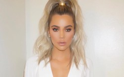 Khloé Kardashian steps out in high ponytail and white look.