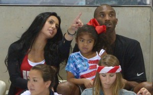 Kobe Bryant with his wife Vanessa and daughter Gianna prepare to watch the final night of swimming at the Aquatics Centre in the Olympic Park during the 2012 Summer Olympics in London
London Olympics Swimming