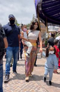 kylie jenner, crop top, jeans, tie-dye, sneakers, air jordan, travis scott, daughter, stormi webster, disneyland, florida, dream kardashian