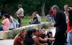 CORRECTS SPELLING TO GARCIA-SILLER, INSTEAD OF GARCIA SELLER - The archbishop of San Antonio, Gustavo Garcia-Siller, right, comforts families outside the Civic Center following a deadly school shooting at Robb Elementary School in Uvalde, Texas, Tuesday, May 24, 2022. (AP Photo/Dario Lopez-Mills)