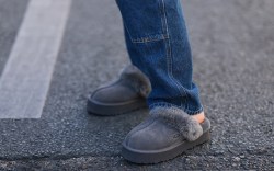 Veronika Heilbrunner seen wearing a dark blue denim jeans pants, and grey charcoal suede UGG Disquette slipper shoes, during Paris Fashion Week - Haute Couture Fall Winter 2022 2023, on July 06, 2022 in Paris, France. (