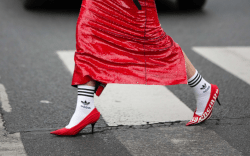 woman wearing red heels and adidas socks