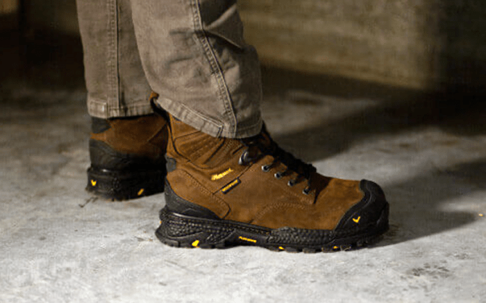 man wearing comfortable work boots on concrete floor